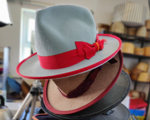Stack of Lina Stein fedoras at Mulranny millinery retreat