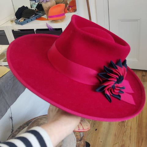 Lina Stein student work in red felt with corsage trimming