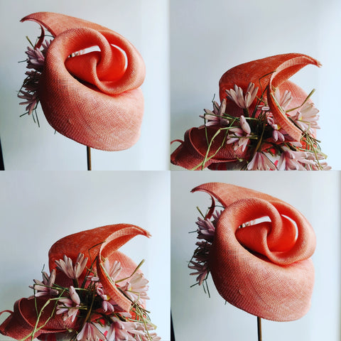 A Swirled Sinamay Fascinator suitable for beginners, featuring a pinkish hue with floral embellishments.