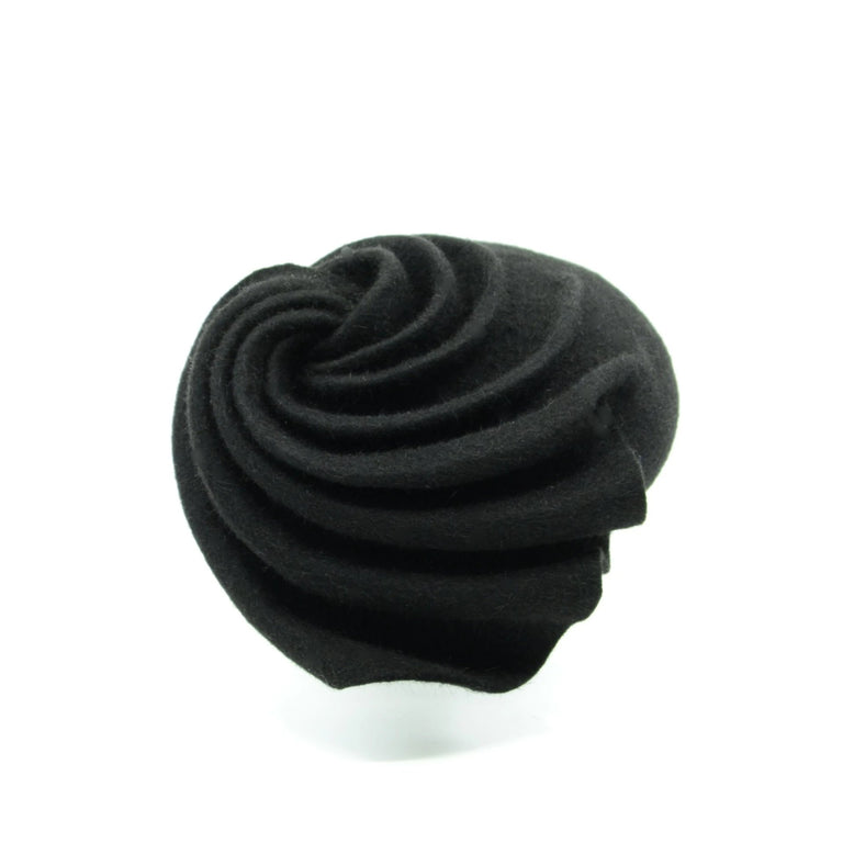 Lina Stein Swirled felt beret. Small hat sits on the left