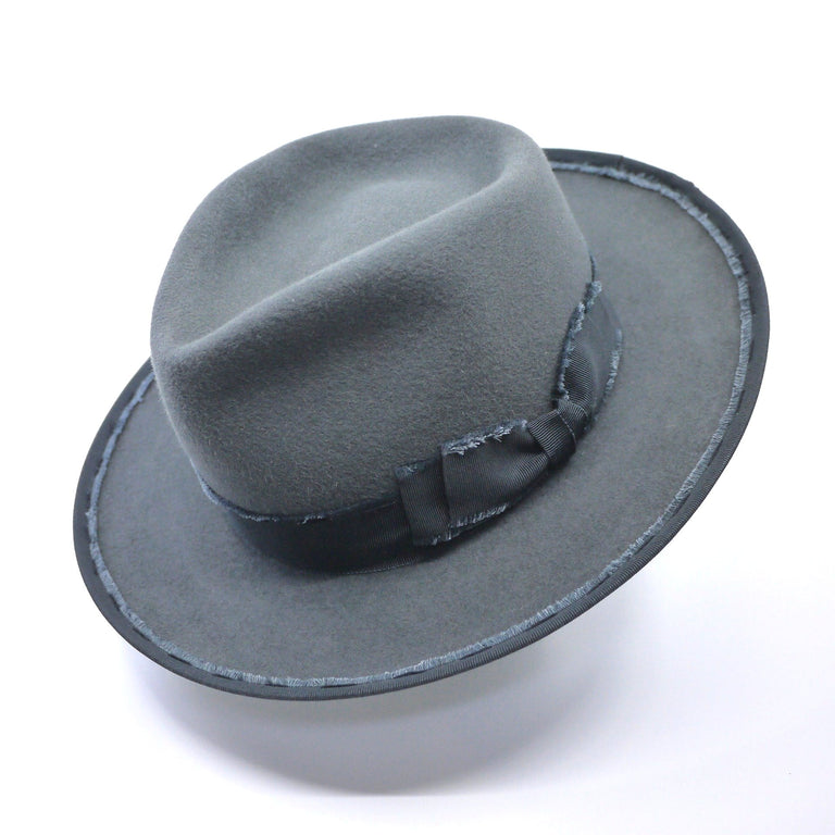 Lina Stein Connemara fedora hat grey with frayed grosgrain ribbon and flip and tuck brim. Front-side view